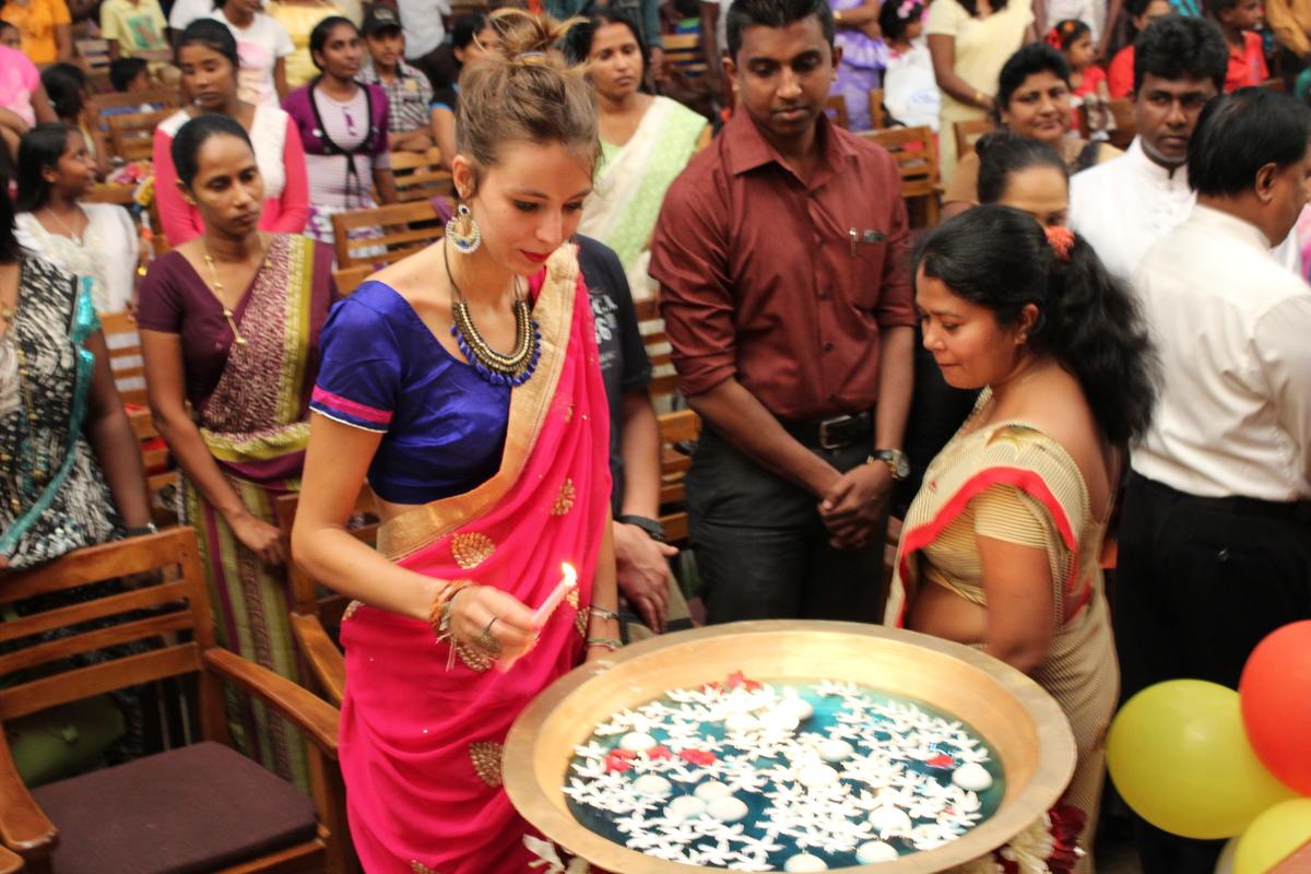 A Projects Abroad volunteer participates in a prayer ceremony in Sri Lanka. An alternative schoolies volunteer at a ceremony on her trip to Sri Lanka.